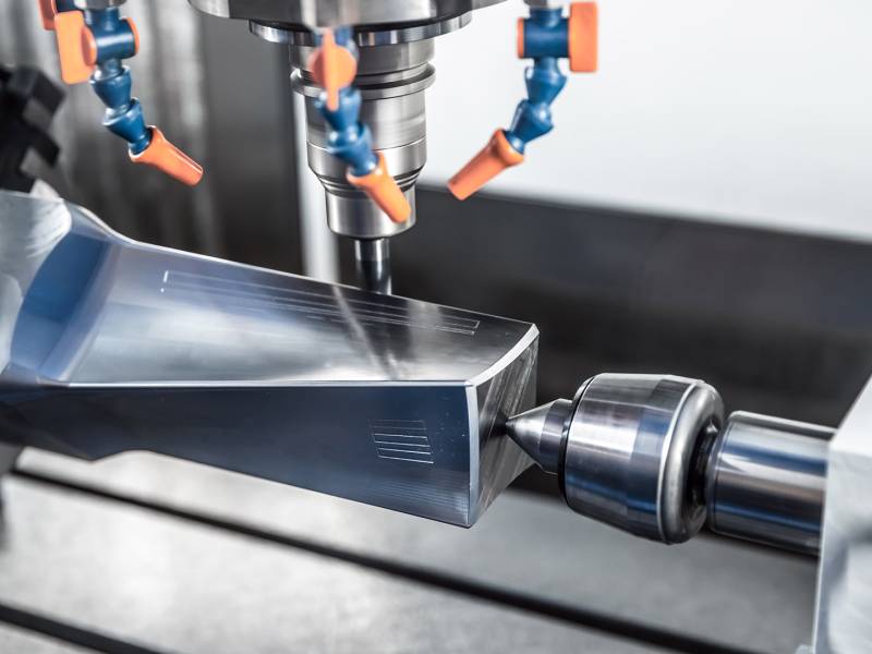 Metalworking CNC milling machine. Cutting metal modern processing technology. Small depth of field. Warning - authentic shooting in challenging conditions. A little bit grain and maybe blurred.