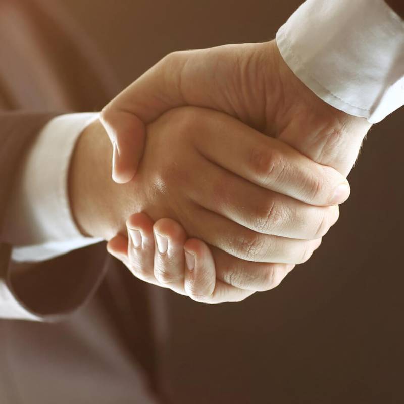 handshake-hand-holding-black-background (1)